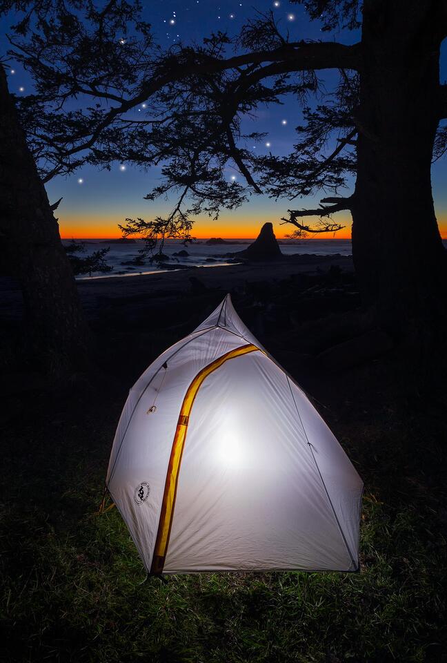 Stars shine over a tent along the coast of Olympic National Park.