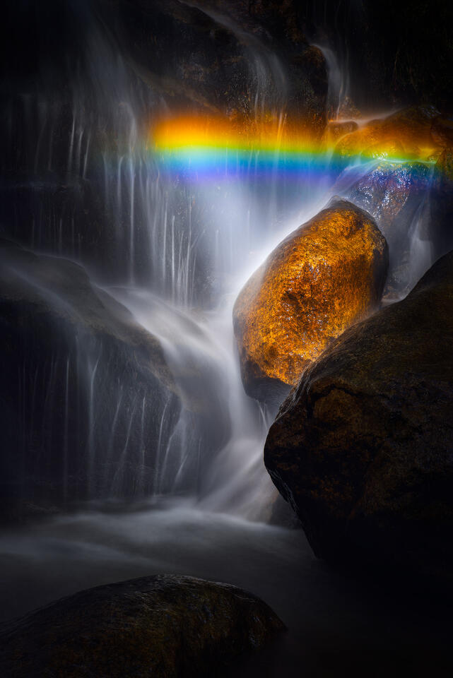 The sun spray from a waterfall in the Adirondack Mountains hits just right to cause a rainbow.
