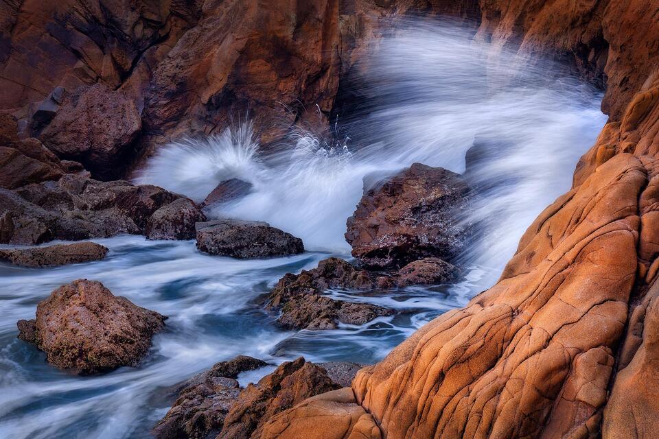 Waves crash and spray at Pfeiffer Beach.