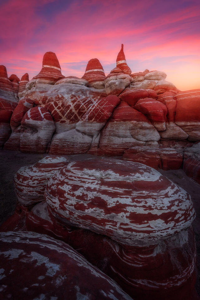 Post-sunset light glows above a canyon.