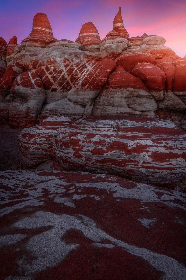 A wonderland of stone deep within the Hopi Lands of Arizona glows under the post-sunset sky.