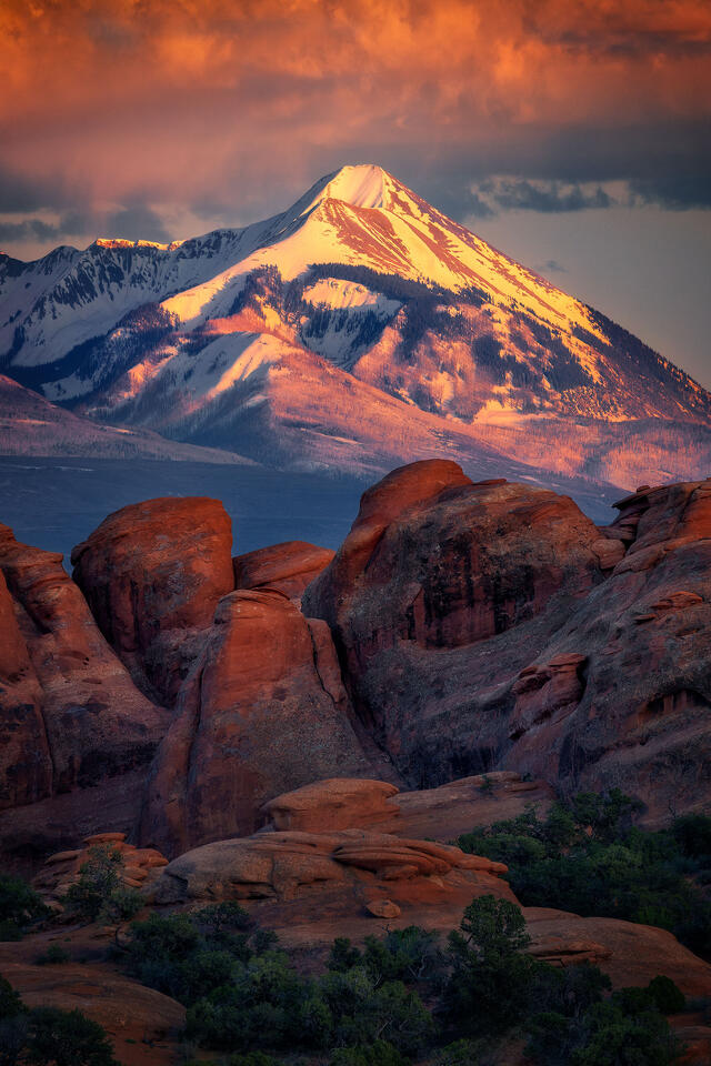 Snowy Mount Peale, in the La Sal Mountain Range, towers above the sandstone formations within Devils Garden Campground.