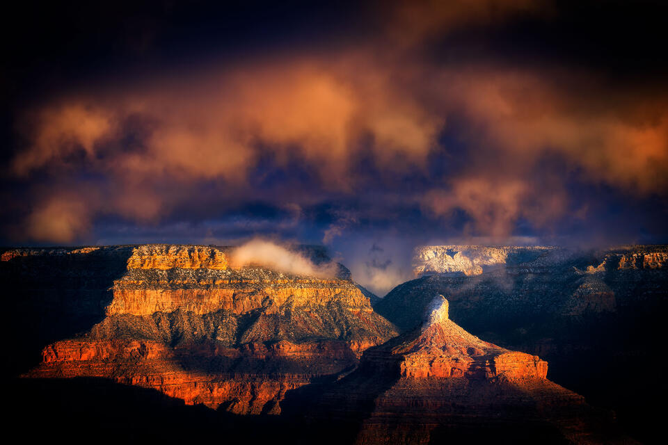Isis Temple and the snowy North Rim of the Grand Canyon bask in the morning sunlight as a winter storm dramatically clears.
