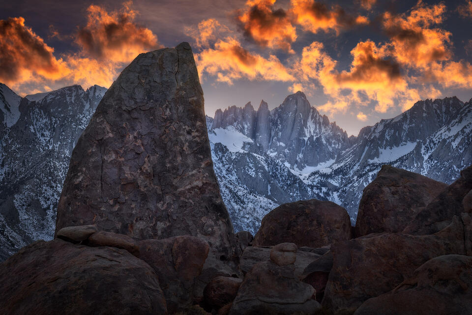The Shark Fin rock formation enjoys a winter view of Mount Whitney in the Alabama Hills of California at sunset.