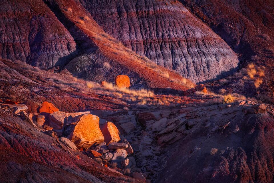 Evening light delicately illuminates the boulders and badlands of Southern Utah.