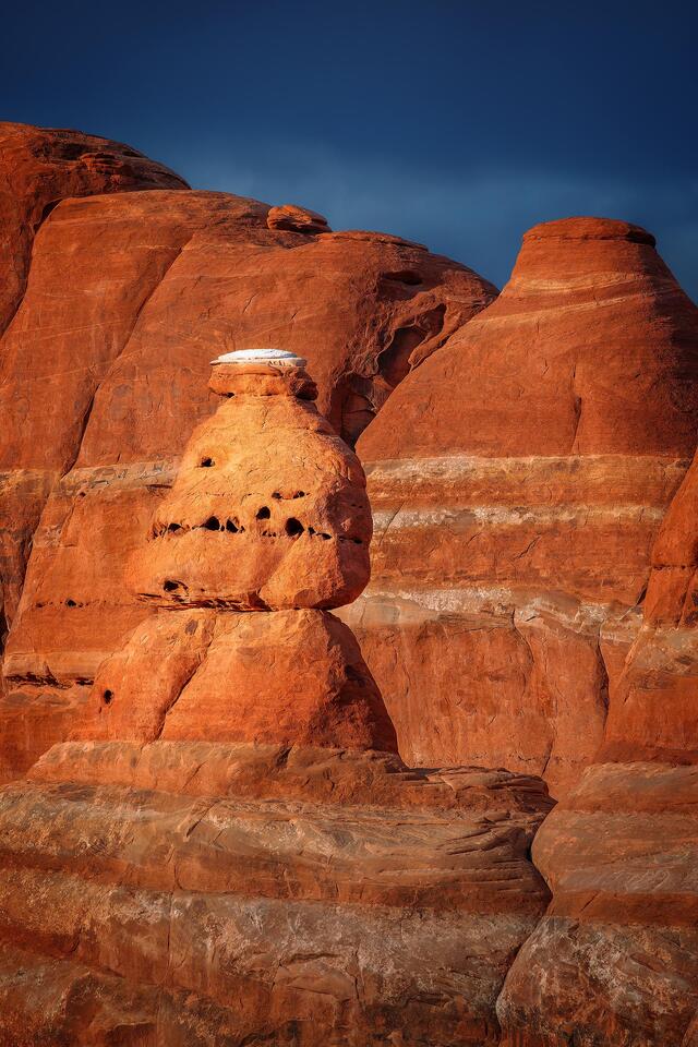 A sandstone formation that, to me, seemed to resemble a beehive basks in the evening sunshine in Utah’s Arches National Park.
