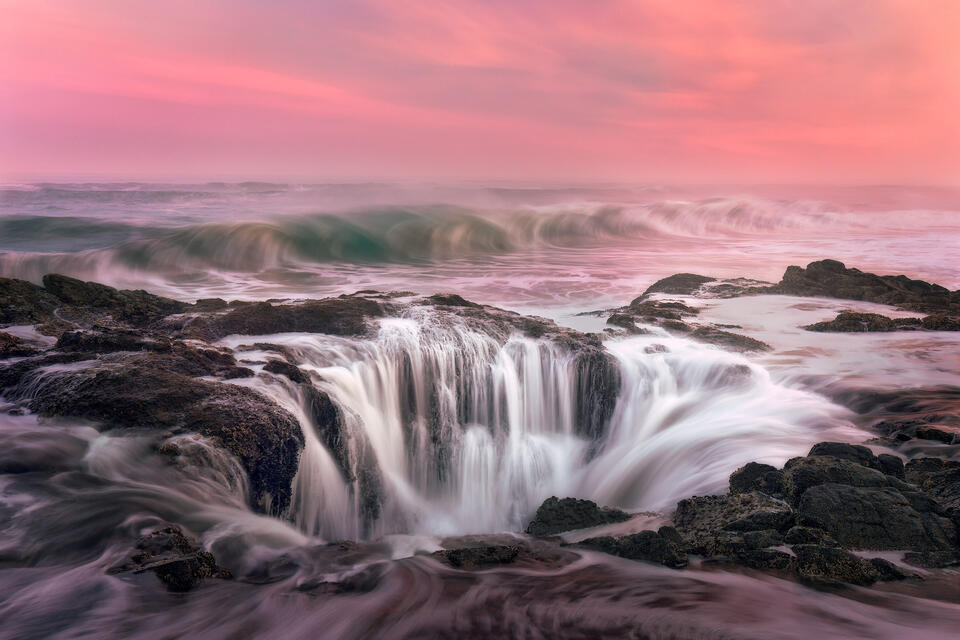 Surf pours down the hole of volcanic rock at Cape Perpetua AKA "Thor's Wall".