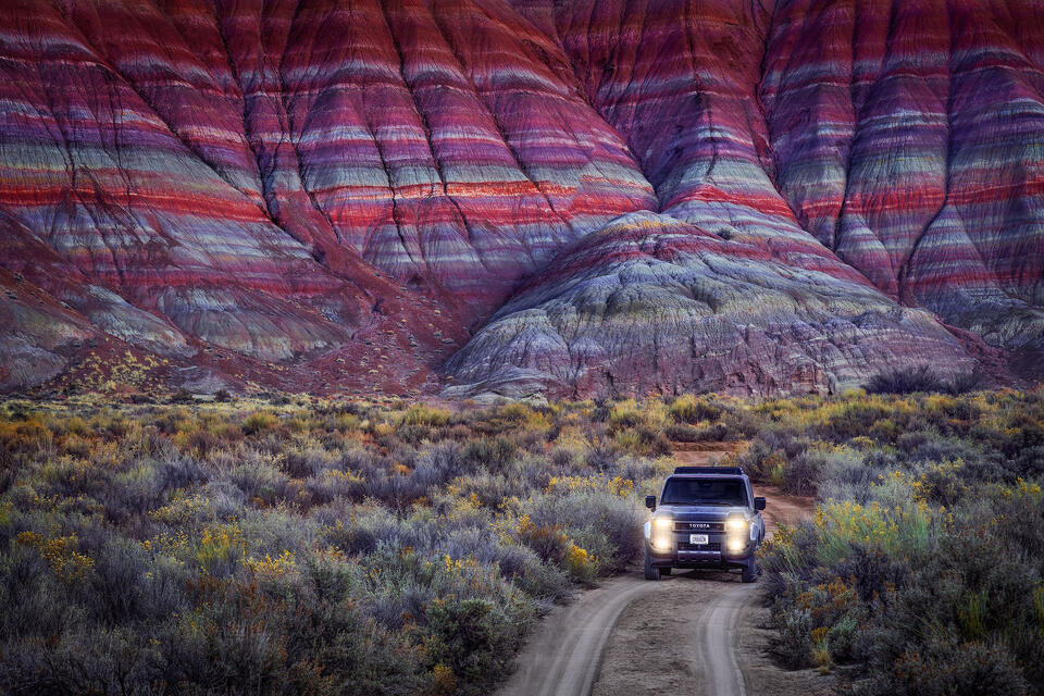 Exploring the lonely backroads at the base of the colorful Paria Badlands in Southern Utah.