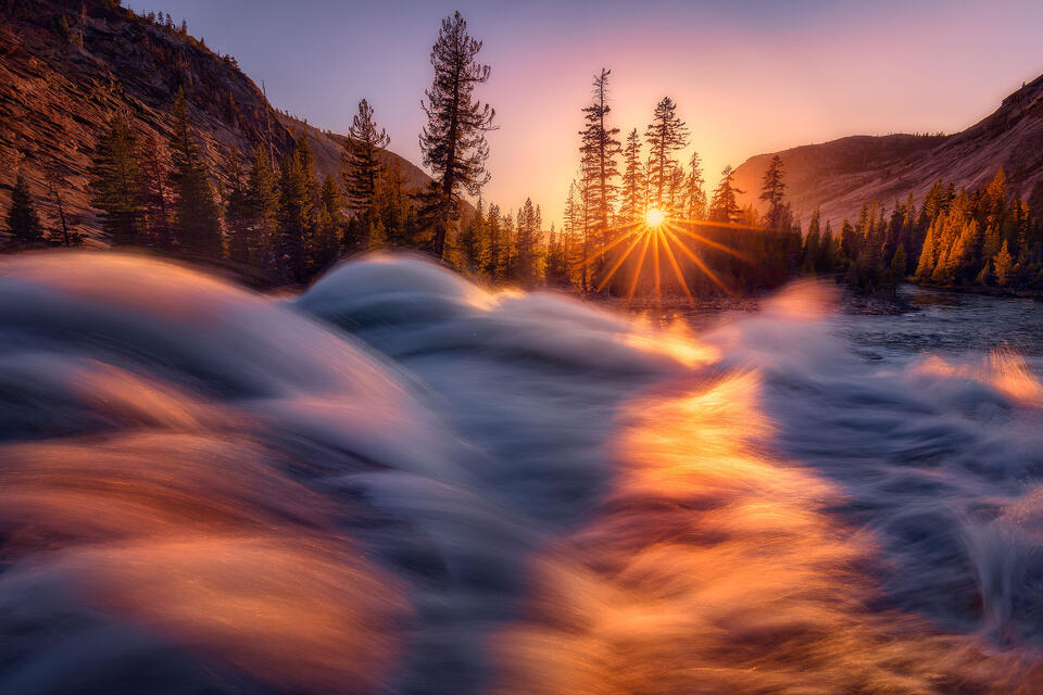 The Tuolumne River sparkles at sunset in California's Yosemite National Park. 
