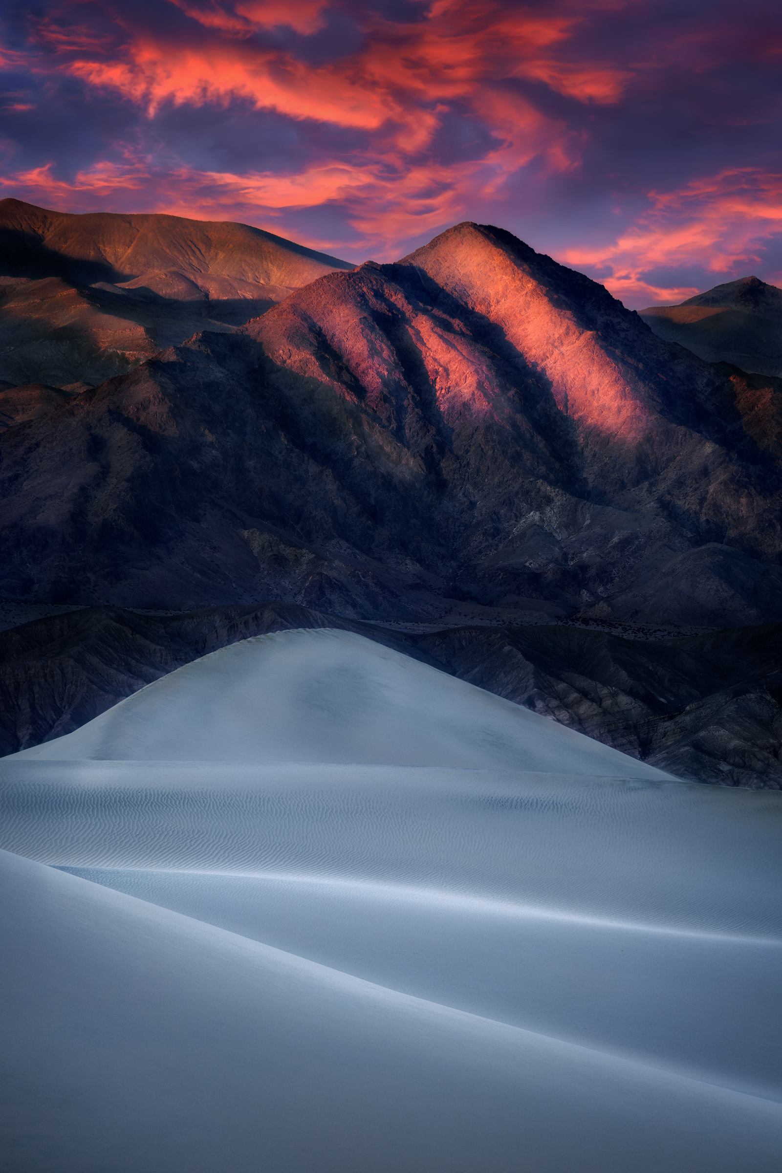 From Stone to Dust The lines and ridges of the mountains seemed to mimic the shape of the dunes during a wonderful sunset in California's Death...